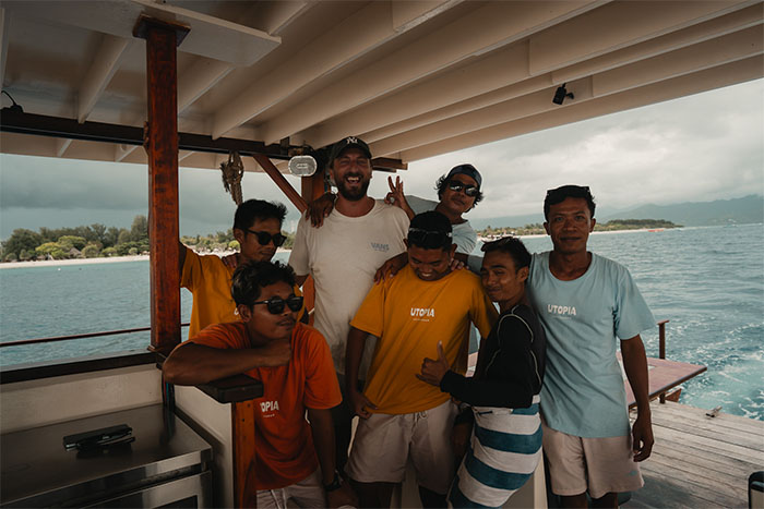 Friendly Utopia Catamaran crew welcoming guests onboard in the Gili Islands
