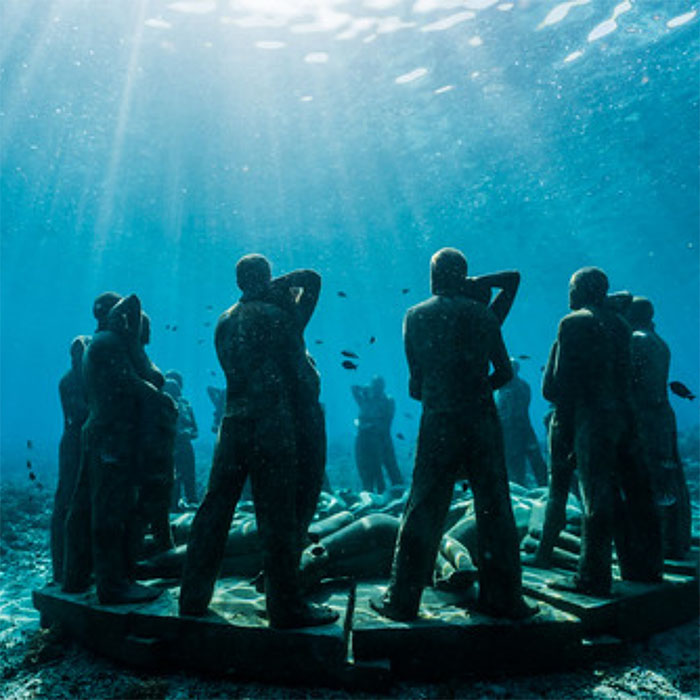 Underwater statues at snorkeling site during Utopia Catamaran Cruise in the Gili Islands