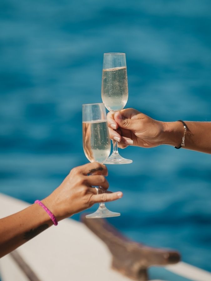 Champagne glasses on deck during a private luxury catamaran cruise